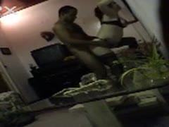 A concealed camera captures a wife masturbating during a sex play while wearing black underwear.
